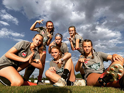 A Group Of People Posing For The Camera